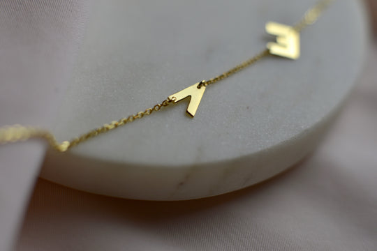 Monogram Karkötő